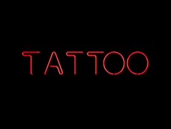Tattoo neon sign Stock Footage