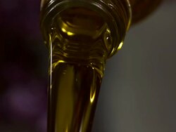 High speed oil pouring from bottle Stock Footage