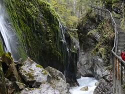 MS Woman with wild river at gorge Wimbach-Klamm / Berchtesgaden, Bavaria, Germany Stock Footage