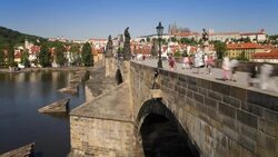 Pedestrians cross the the famous Charles Bridge in Prague. Stock Footage