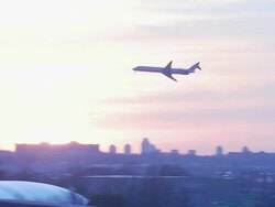 Jet flying across sunset, USA Stock Footage