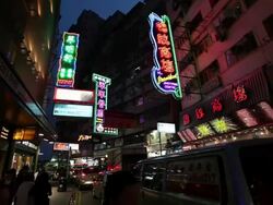 MS Shot of Street traffic and neon signs at night / Hong Kong, China Stock Footage