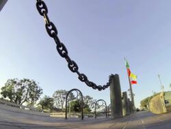 Skateboarder doing an ollie over chains. Stock Footage