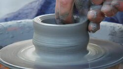 man creates pottery on a potter's wheel Stock Footage