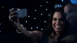 Celebrity couple snap photos with smartphone in limousine at awards show Stock Footage