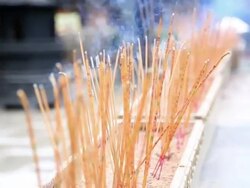 HD: joss stick and candle flame Stock Footage