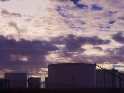 Time Lapse of Clouds over Oil Tank Farm Stock Footage