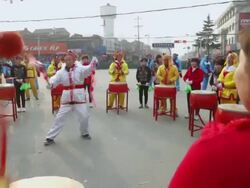 MS TS Villagers performing gongs and drums in traditional festive folk celebration or carnival during chinese spring festival  AUDIO  / xi'an, shaanxi, china Stock Footage
