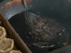 ZI Woman frying rice cakes in oil / Luang Prabang, Laos Stock Footage