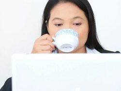 Dolly: Businesswoman Working with laptop drinking coffee Stock Footage