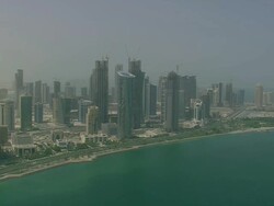 MS AERIAL PAN ZI View of skyscraper in city / Qatar Stock Footage