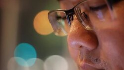 salary man watching screen, reflection in glasses Stock Footage