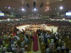 WS Large church interior filling up with people standing and praying with digital screen / Lagos, Nigeria Stock Footage