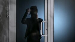 Burglar with flashlight Stock Footage