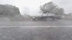 Car driving at rainy day - side view - 4K Stock Footage