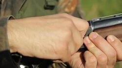 Filling in rifle ammunition Stock Footage