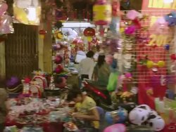 MS SLO MO POV side Shot of driving past local festive shops / Hanoi, Vietnam Stock Footage