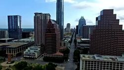 Summer Sunrise Close to Downtown Skyscrapers Aerial Over Austin Texas Congress Avenue Iconic Landmark View from the Air 4K Stock Footage