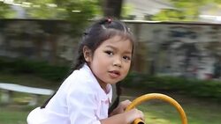 Girl is playing at amusement park Stock Footage