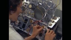 CU HA Woman repairing electronic circuit board / United States Stock Footage