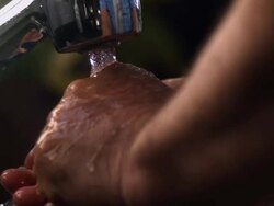 CU SLO MO Washing hands at kitchen sink Stock Footage