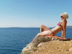 HD DOLLY: Woman Sunbathing On Idyllic Beach Stock Footage
