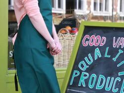 Portrait of shop owner outside grocery store Stock Footage