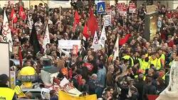 Thousands march as unions strike over austerity cuts; scuffles outside parliament News Clip