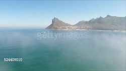 Fishing boat in mist in Hout Bay South Africa Stock Footage