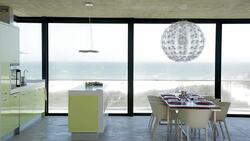 Modern kitchen and dining room with ocean view Stock Footage