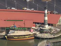 MS AERIAL View of light house with travelling boat / South Carolina, United States Stock Footage