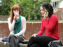 MS Two women at lunch break while phone call disrupts conversation / Portland, Oregon, USA Stock Footage