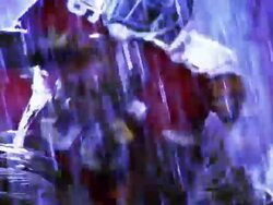 OVEREXPOSED MS football players tackling opposing player with ball in rain Stock Footage