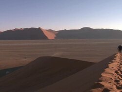 People walking on sand dune, Sossusvlei, Namib-Naukluft, Namibia Stock Footage