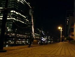 WS  woman athlete running to  camera in urban environment at night Stock Footage
