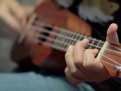 Girl playing ukulele,Close-up Stock Footage