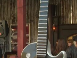 ATMOSPHERE: Guitar at the Ozzy Osbourne Signs a 10-Foot Guitar at The House Of Blues at Hollywood CA. (Footage by WireImage Video/GettyImages) Stock Footage