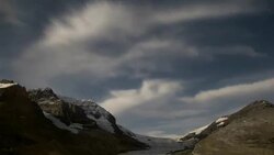 Glacier Clouds Time Lapse and Stars at Night Stock Footage