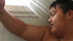 Young relaxed man taking a shower Stock Footage