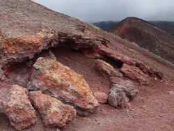 Mount Etna, tourists walking on the volcanic rocks on the mountain Stock Footage