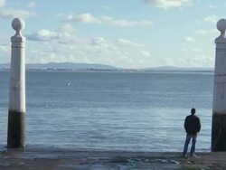 MS View of Column of Ancient landing stage and one man standing in stage  / Lisbon, Lisbon, Portugal Stock Footage