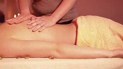 Beautiful woman enjoying massage dolly shot Stock Footage