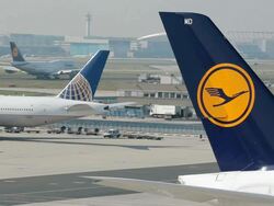 WS View of plane parking area on airport and landing airplane / Frankfurt, Hesse, Germany   Stock Footage
