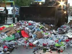 Medium Shot - Garbage truck and large pile of trash on street / New Orleans Louisiana Stock Footage