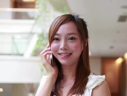 Young woman using a smartphone in private room of the hotel Stock Footage
