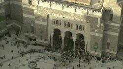 Crowds of the Muslim faithful enter and leave a sacred site in Saudi Arabia. Stock Footage