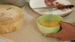 Hands cracking egg in a bowl Stock Footage