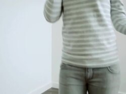 Young woman standing on flooded floor on phone Stock Footage