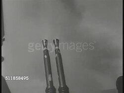 1945: PACIFIC THEATER: HA WS Carrier w/ aircraft in flight above. MS Anti-aircraft gun barrels firing, recoiling. Soldier loading ammunition. DANGEROUS WATERS: WS Ocean w/ strafing bullets, water exploding from bomb, black flak smoke in air. WWII Instructional Video