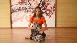 One girl in yoga class meditating in position Stock Footage